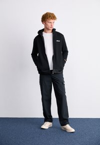 Ellesse MILLEROS - Mikina so zipsom - black