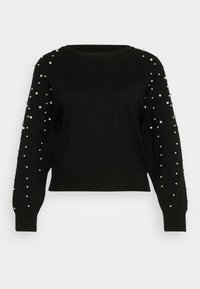 Schwarzer kurz geschnittener Pullover mit langen Ärmeln, verziert mit Perlen entlang der Arme und mit einem gerippten Ausschnitt und Saum. Weiches Strickmaterial.