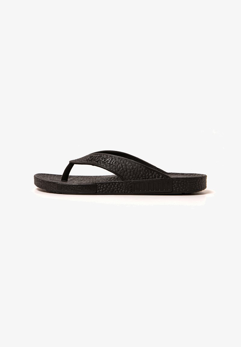 Black flip-flop sandal made of textured rubber. Features a simple thong design and flat sole with subtle branding on the strap.