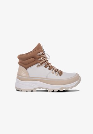 High-top hiking boot with a white and light brown color scheme. Features durable leather, metal eyelets, and textured rubber sole for traction.