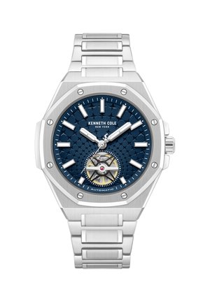 Orologio automatico Kenneth Cole con quadrante blu testurizzato, indici orari d'argento, cassa esagonale in argento e bracciale a maglie in acciaio inossidabile.
