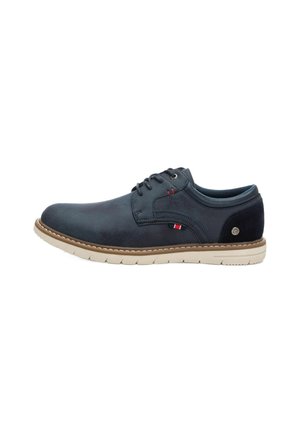 Zapatos de cuero azul oscuro para hombres con cordones, suela beige, costura elevada y detalle de logo lateral. Textura suave con un diseño de punta redondeada.