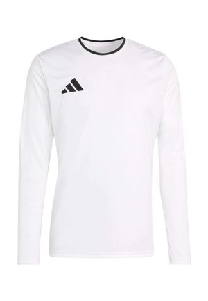 Biała sportowa koszulka z długim rękawem, czarnym obszyciem wokół szyi i czarnym logo Adidas na górnej lewej części klatki piersiowej.