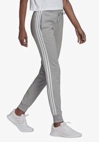 adidas Sportswear Spodnji deli trenirk - medium grey heather/white