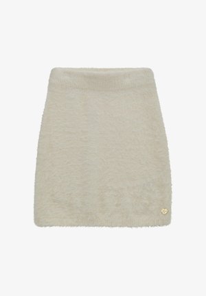 Jupe en tricot pelucheux couleur crème avec taille côtelée et petite décoration en forme de cœur doré près de l'ourlet.