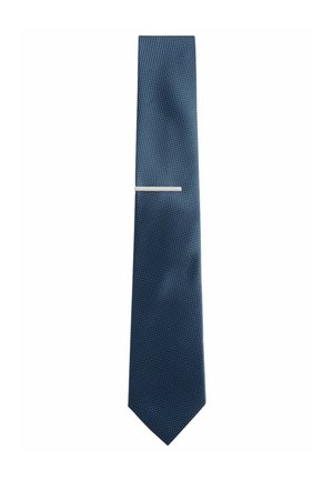 Marineblaues Krawatte mit strukturiertem Muster und schlankem Design. Beinhaltet eine silberne Krawattennadel für zusätzliche Details.