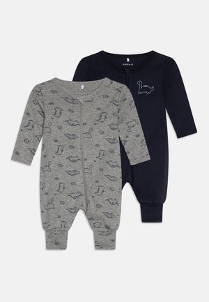 Duos kūdikių rompers: vienas pilkas su dinozaurų raštu, užtrauktuko uždarymas ir ilgos rankovės; kitas tamsiai mėlynas su dinozaurų kontūru, ilgos rankovės ir be uždarymo.