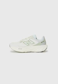 Lightweight running shoes in white and mint green, featuring a breathable mesh upper, padded collar, and cushioned sole with textured accents.
