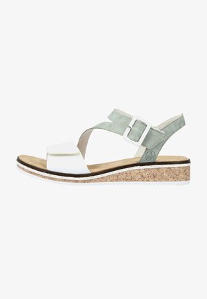 White and light green sandal with a cork midsole, adjustable buckle, and a flat sole featuring a textured bottom for grip.