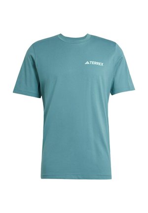 Light blue cotton t-shirt featuring short sleeves, a round neck, and a white TERREX logo on the chest. Smooth texture, simple design.