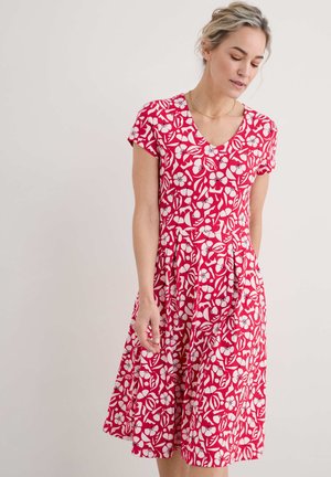 Red and white floral print dress with a V-neck, short sleeves, pleated skirt, made of lightweight fabric. Smooth texture, feminine cut.