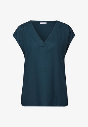 Dunkeltürkisfarbene kurzärmlige Bluse mit V-Ausschnitt. Glatter, leichter Stoff. Lockere, lässige Passform mit dezentem Gathering an den Schultern.