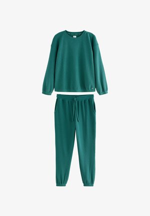 Green ribbed long-sleeve sweatshirt and matching jogger pants with elastic cuffs and drawstring waist, displayed on white background.