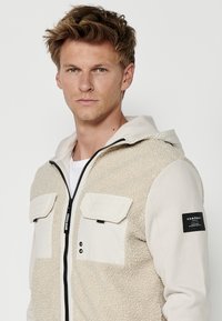 Koroshi Jachetă din fleece - beige