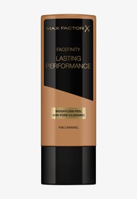 Podkład Max Factor Facefinity Lasting Performance w beżowo-brązowej tubie. Czarny korek, złoty napis oraz etykieta z odcieniem "113 Karmel". Gładka konsystencja.