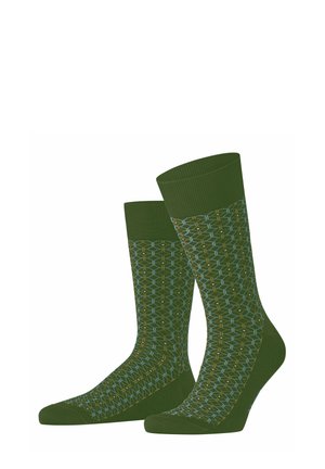 Paar grüne Socken mit geometrischem sechseckigem Muster in Blau und Gelb, gerippten Bündchen und festen Zehen- und Fersenbereichen.