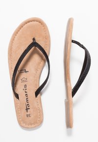 Musta sandaali flip-flop, jossa on teksturoituneet hihnat ja vaaleanruskea mokkanahkainen pohja. Ominaisuuksiin kuuluu kevyt rakenne ja huomaamaton brändäys pohjassa.