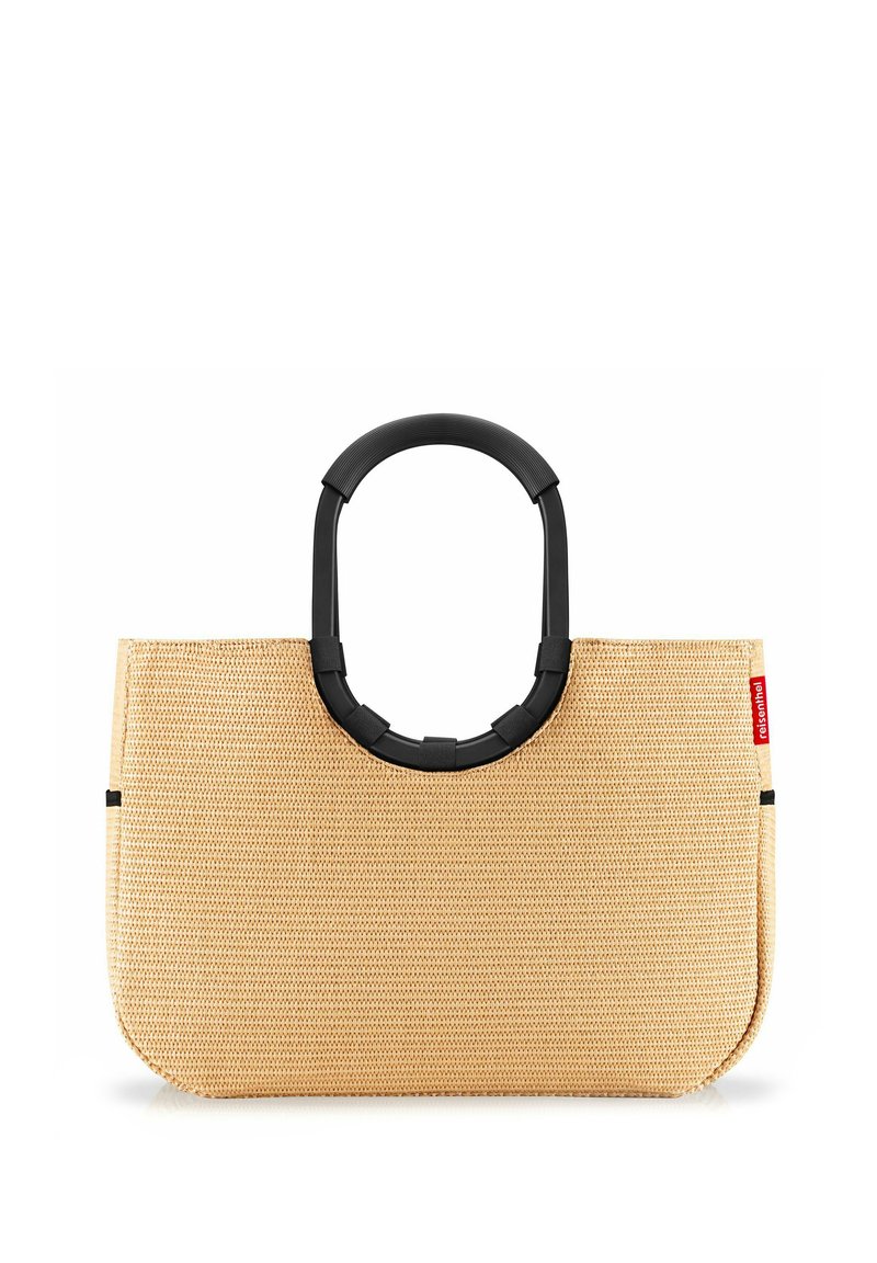 Beige woven tote bag with a rounded black handle, featuring a smooth texture and minimalist design, highlighted by a red brand tag.