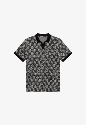 Musta poolopaita, jossa on valkoinen palmutrikoomalli, musta kaulus ja mustat hihansuut.