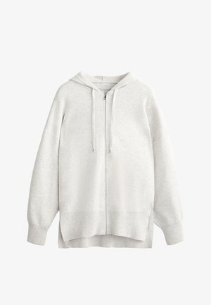 Svetlo siva zip-svetilka s kapuco, narejena iz mehkega blaga. Ima kapuco, sproščen kroj, spuščena ramena ter rebraste manšete in rob.