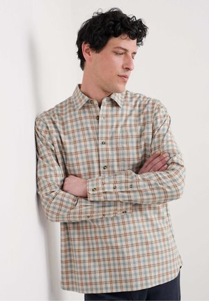 Camicia button-up in crema, caratterizzata da un motivo a quadretti marrone e blu. Realizzata in tessuto leggero con colletto e polsi a bottoni.