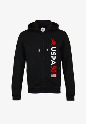 Black zip-up hoodie made of cotton blend. Features red printed logo "USPA 90" and American flag. Includes front pockets and adjustable drawstring hood.