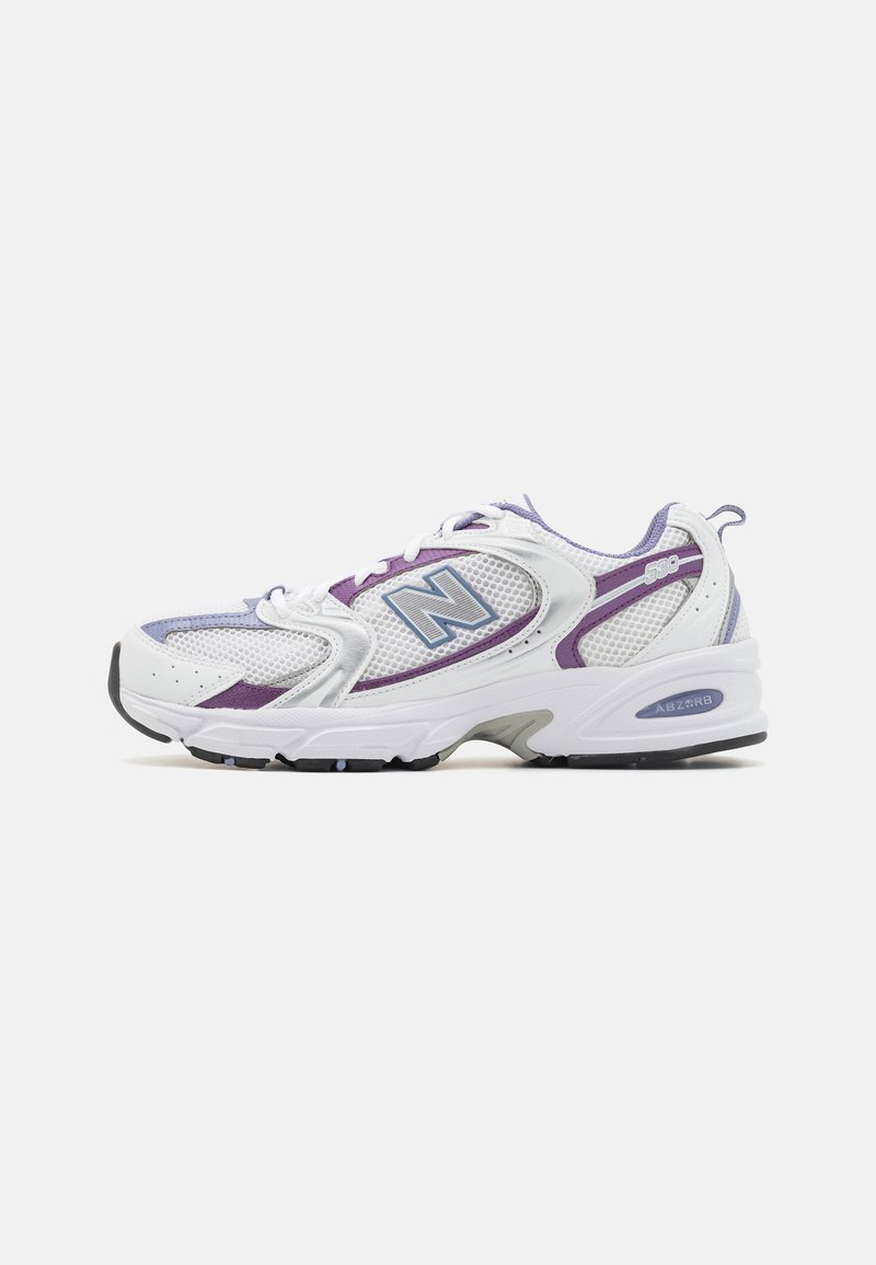 Sneakers feature a white mesh upper with purple and grey accents, rounded toe, cushioned sole, and "ABZORB" branding on the heel.