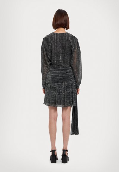 Black, pleated mini dress with long sleeves, made from a shimmering fabric. Features a gathered waist and a cascading back detail.