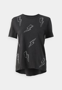 Zwarte t-shirt met ontwerpen van strasbliksemflitsen. Korte mouwen, ronde hals en een afgeronde zoom met een zachte katoenen textuur.