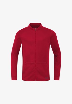 Czerwona bluza z zamkiem na całej długości, z wysokim kołnierzem, długimi rękawami, przednimi kieszeniami i subtelnym logo wzdłuż zamka. Miękka, gładka tekstura materiału.
