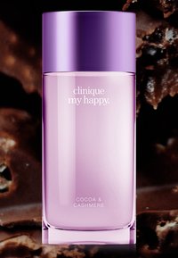 Clinique My Happy doft, glasflaska, ljuslila färg, rundade kanter, cylindrisk form, silverdetaljer, märkt "Cocoa & Cashmere."