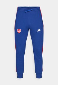 Modré bavlněné tepláky s červenými bočními pruhy, s logem Arsenal a logem Adidas. Elastický pas se stahovací šňůrkou pro úpravu.