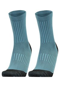 Turquoise ribbed socks with a black reinforced toe and heel. Lightweight material with a mid-calf design. Striped texture throughout.