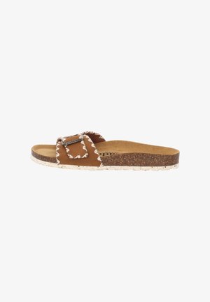 Brown suede slide sandal with a scalloped edge, adjustable strap featuring a silver-tone buckle, and a textured cork and white rubber sole.