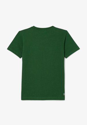 Grünes Baumwoll-T-Shirt mit kurzen Ärmeln, Rundhalsausschnitt und schlichtem Design. Verfügt über ein kleines Etikett auf der linken Unterseite.