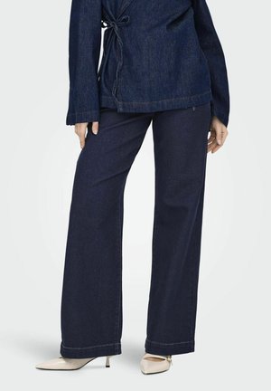 Platėjantys džinsai - dark blue denim