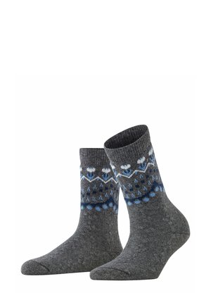 Calze grigie con un bordo a coste presentano un motivo blu e bianco, inclusi fiocchi di neve e pois, realizzate in un tessuto testurizzato.
