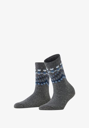 Calze grigie con un bordo a coste presentano un motivo blu e bianco, inclusi fiocchi di neve e pois, realizzate in un tessuto testurizzato.