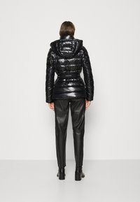 Calvin Klein BELTED PADDED JACKET - Winterjas - black