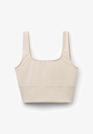 Top corto beige realizzato in un tessuto morbido ed elastico. Presenta spalline larghe, un neckline quadrato e un design aderente con un dettaglio cucito nella parte inferiore.