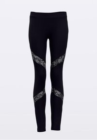 Leggings pretos com painéis texturizados de renda em padrão diagonal, oferecendo um design contrastante. Tecido liso com forma ajustada ao corpo.