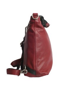 Red leather handbag with a soft texture, curved shape, and silver hardware. Features a removable shoulder strap and black accent.