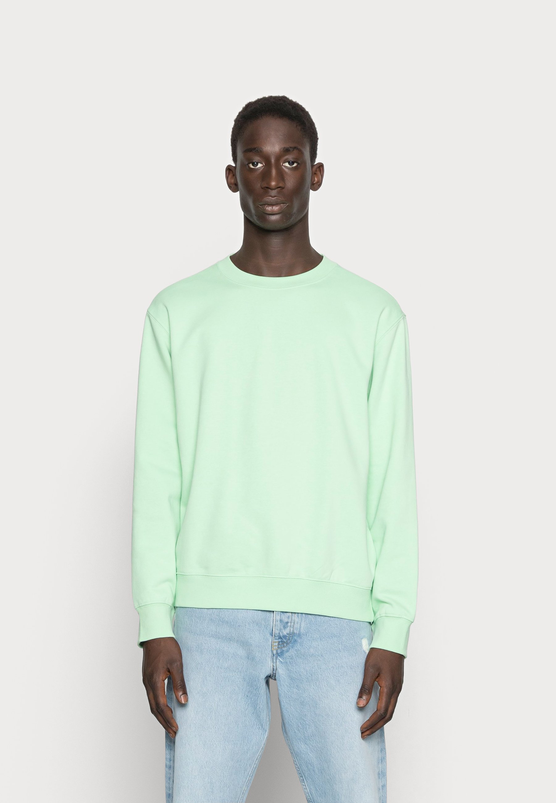 light green sweatshirt