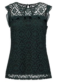 Top de encaje verde oscuro con un patrón de diamantes, mangas con volantes tipo capucha y cierre de llave en la parte posterior. Diseño texturizado con detalles florales.
