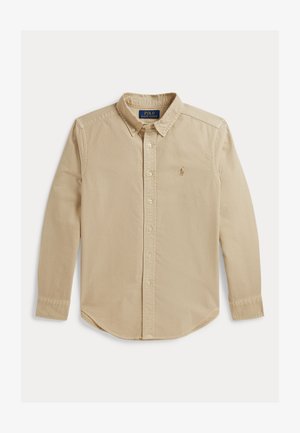 Béžová košeľa s dlhým rukávom na gombíky, s golierom a vyšitým logom Polo Ralph Lauren na ľavej strane hrude.