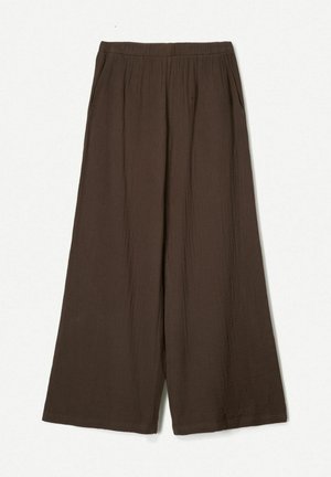 Pantalons amples marron en tissu léger, dotés d'une taille élastique et d'une texture subtile avec des poches latérales.