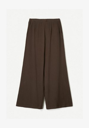 Rjave hlače širokega kroja, narejene iz lahkega materiala, z elastičnim pasom in diskretno teksturo ter stranskimi žepi.