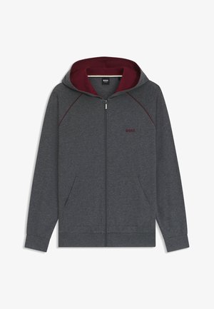 Grauer Reißverschluss-Hoodie mit burgunderrotem Innenfutter. Zu den Eigenschaften gehören Fronttaschen, gerippte Bündchen und ein auf der Brust gesticktes Logo. Weicher Stoff.
