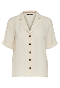 Chemise à manches courtes beige clair avec col, dotée de cinq boutons marron, texture douce et poignets retroussés.