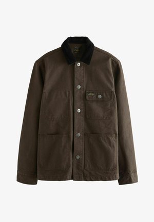 Veste en toile marron avec un col en velours côtelé, comportant deux grandes poches avant, une petite poche poitrine et des boutons-pression en métal.